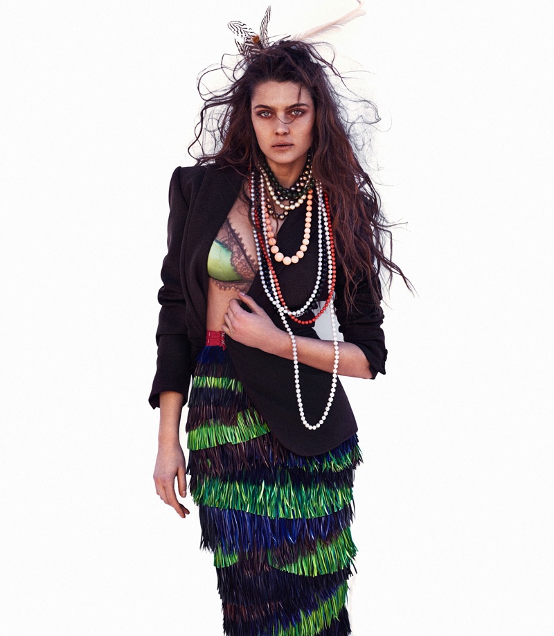 Marina layers up with a fringe embellished skirt, bra top and jacket