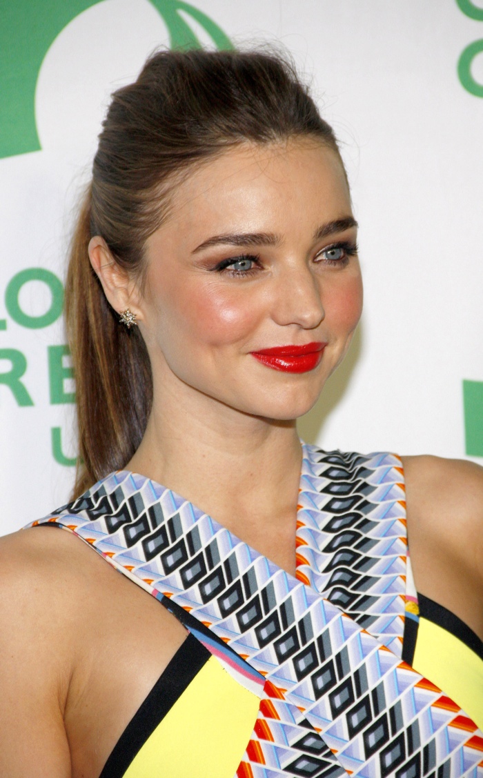 Miranda Kerr went for a simple yet elegant ponytail hairstyle at a 2013 event. Paired with a red lip and blushed cheeks, the model showed that an updo can be just as glamorous as wearing your hair down. Photo: Tinseltown / Shutterstock.com
