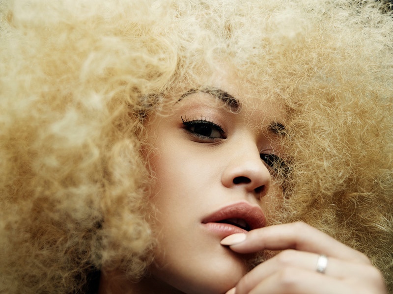 The singer rocks a new look--a blonde, curly hairstyle.  Photo: Rankin