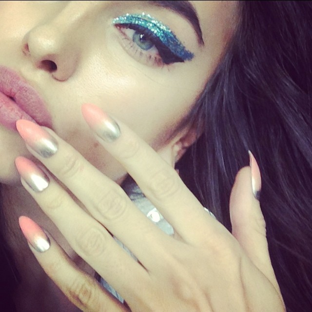 Irina Shayk sports blue eyeshadow and manicured nails in this Instagram photo