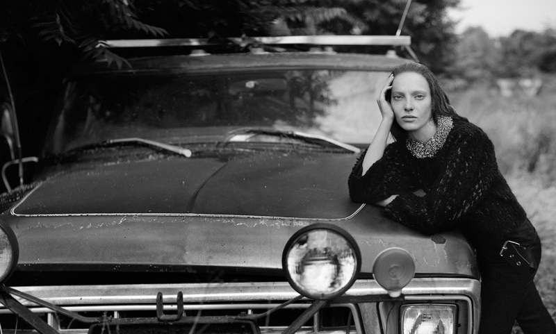 Zlata gets rustic as she poses alongside a vintage car