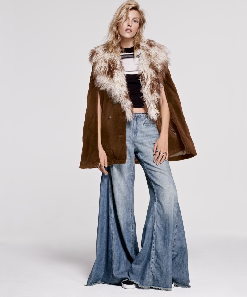 A fur embellished jacket with flared denim makes quite the statement