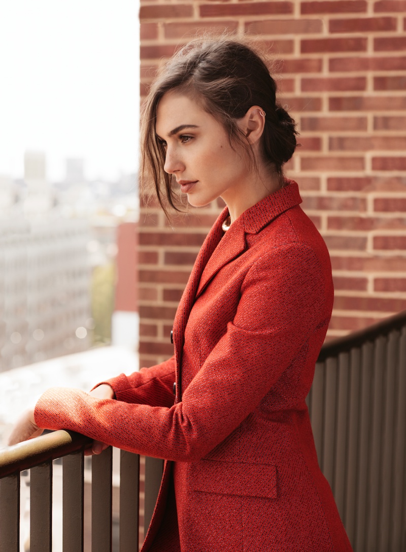 Gal wears red jacket in this image