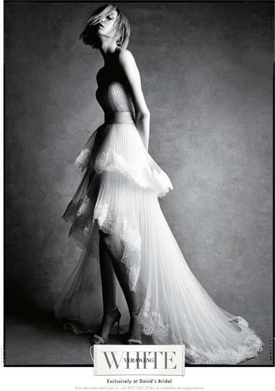 A wedding dress featuring a tiered skirt from White by Vera Wang