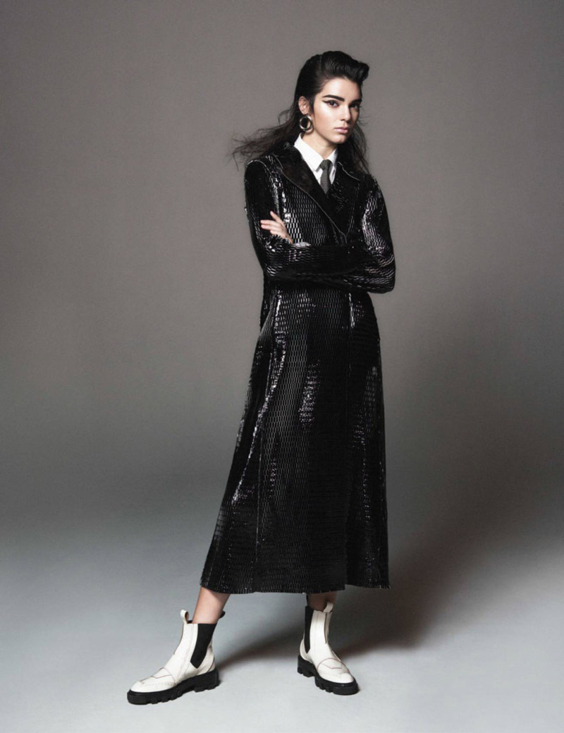 Kendall models a Dior patent leather coat