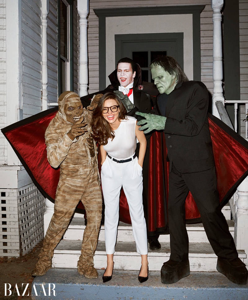 A mummy, vampire and Frankenstein pose alongside Miranda Kerr