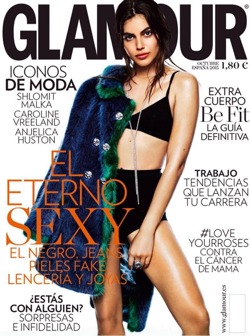 Shlomit Malka stars on Glamour Spain's October 2015 cover. Photographed by Gregory Derkenne, the model wears a fur jacket with black bra top and shorts.