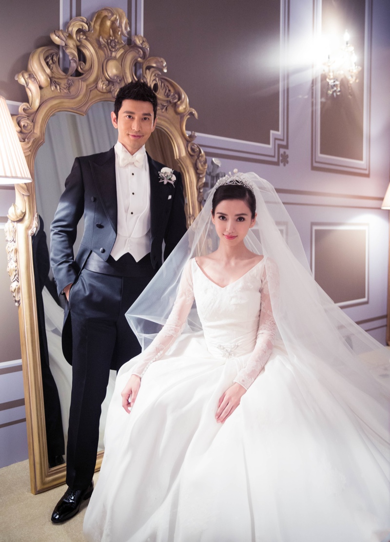 Angelababy and husband Huang Xiaoming pose in their wedding looks. Photo: Dior