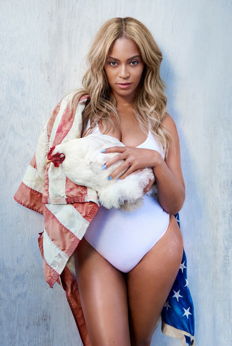 Beyonce poses with a chicken in this pictures