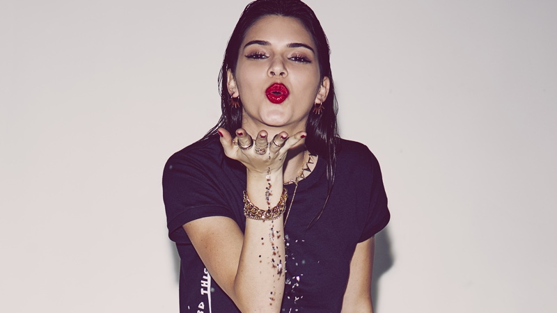 Kendall blows some glitter at the camera in this picture
