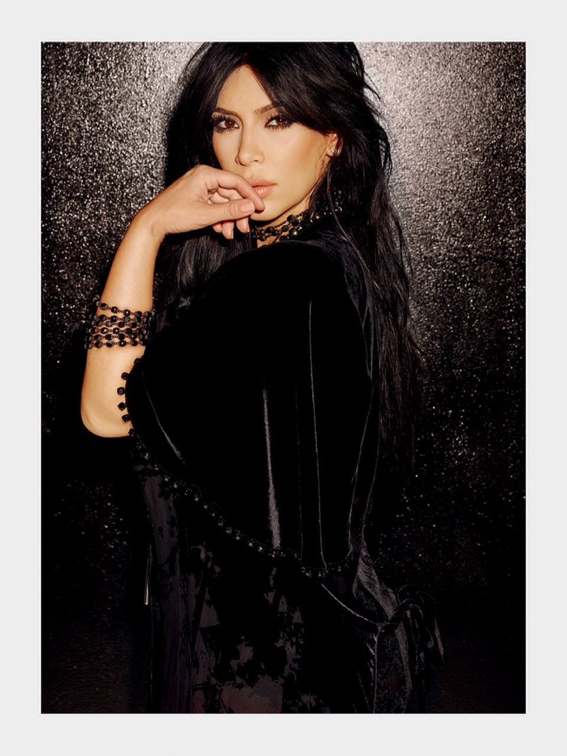 Kim Kardashian looks rock and roll glam in a caped look