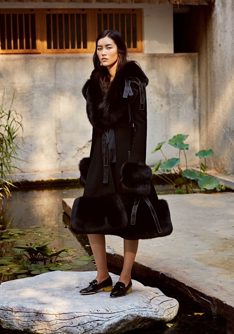 Liu poses in black fur coat with flared hemline