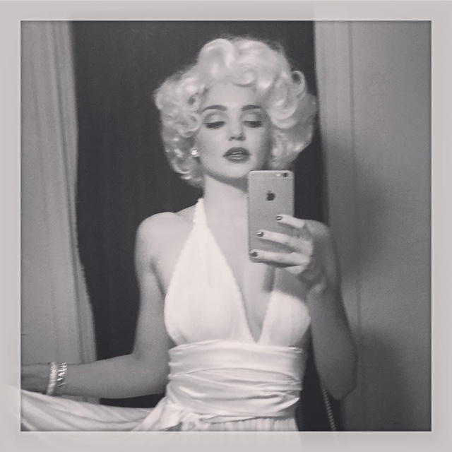 Miranda Kerr channels Marilyn Monroe in the 7 Year Itch wearing a white dress and blonde wig