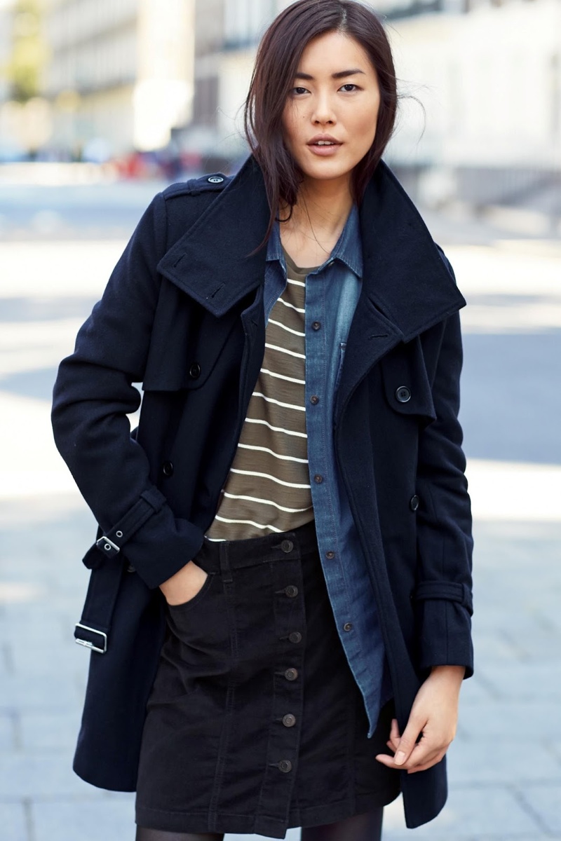 Next showcases a layered look with a open jacket, striped shirt and denim top