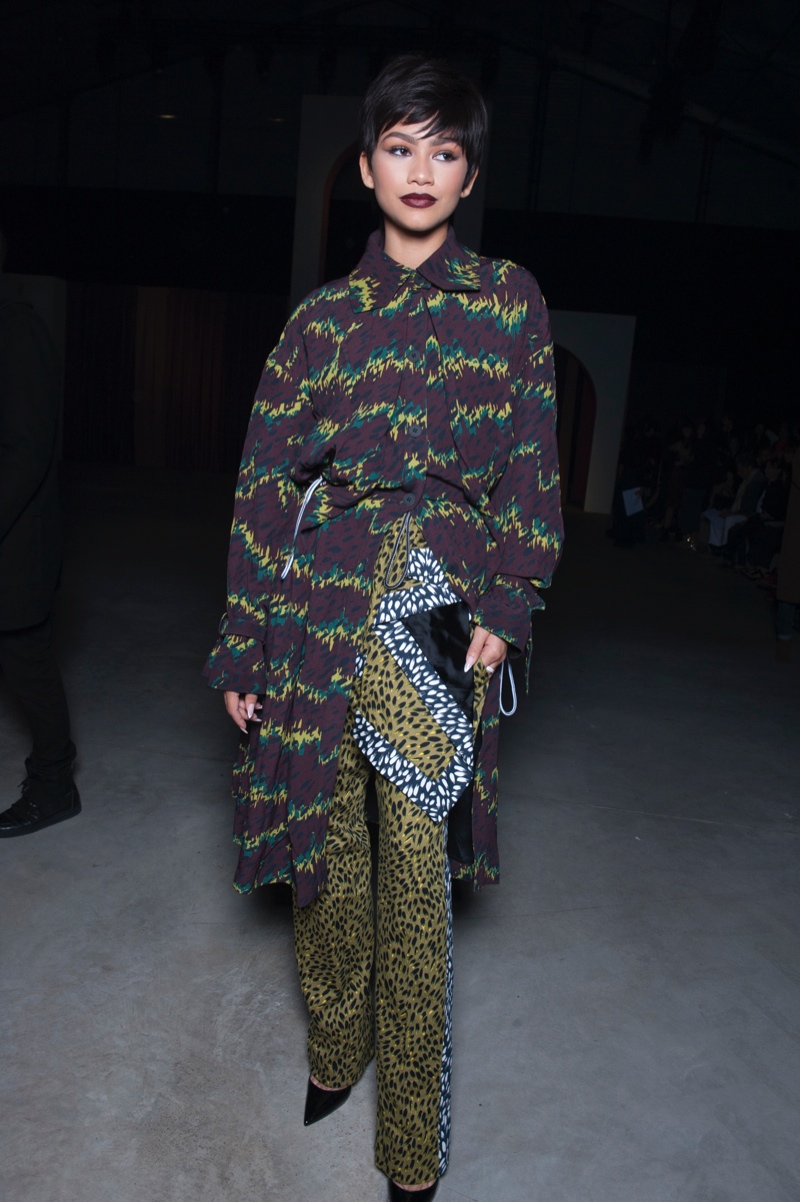 Zendaya attends the Kenzo spring-summer 2016 show held during Paris Fashion Week. The actress and singer wears a look from the brand's fall collection while sporting a short hairstyle.