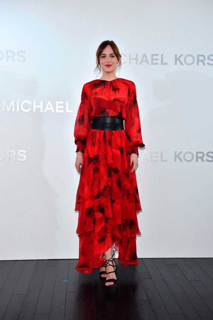 Dakota Johnson at Michael Kors Ginza store opening in Japan wearing red poppy print dress