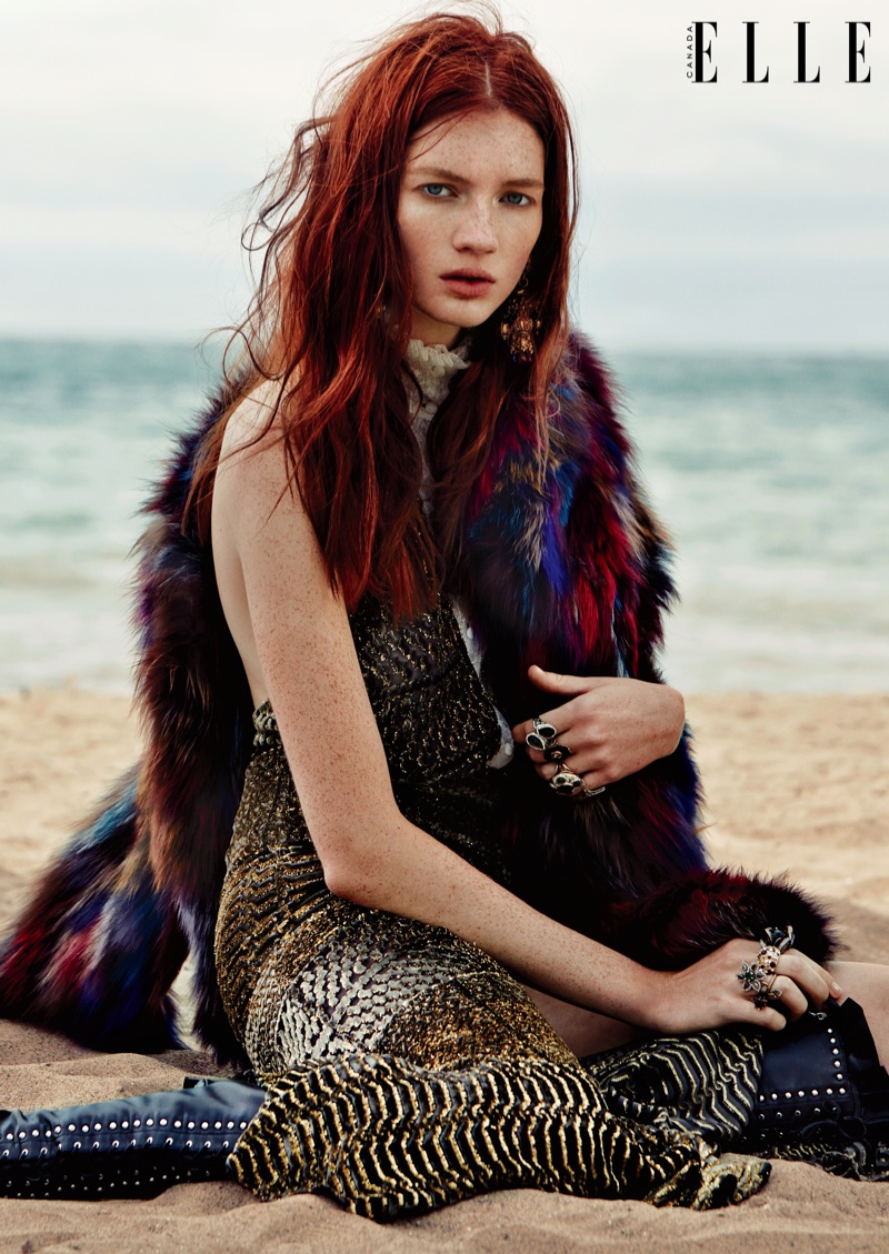 The model wears bohemian inspired looks on the beach for ELLE Canada