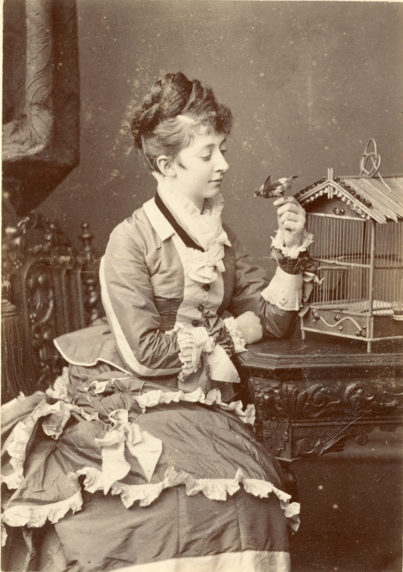 Two-tone reception dress trimmed with pleated ruffles. Photo by Appleton & Co. (Bradford, UK). 1872. Timeline Archive. 