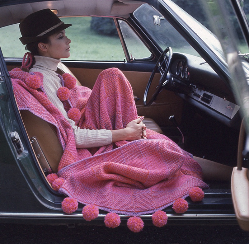 Hot pink poncho edged with giant pom-pons. Unknown photographer. Circa 1965. Timeline Archive. 