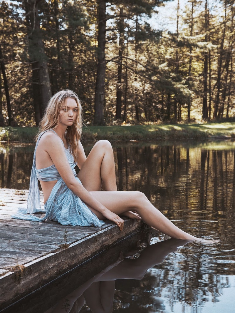 The model poses in relaxed style for the outdoors shoot