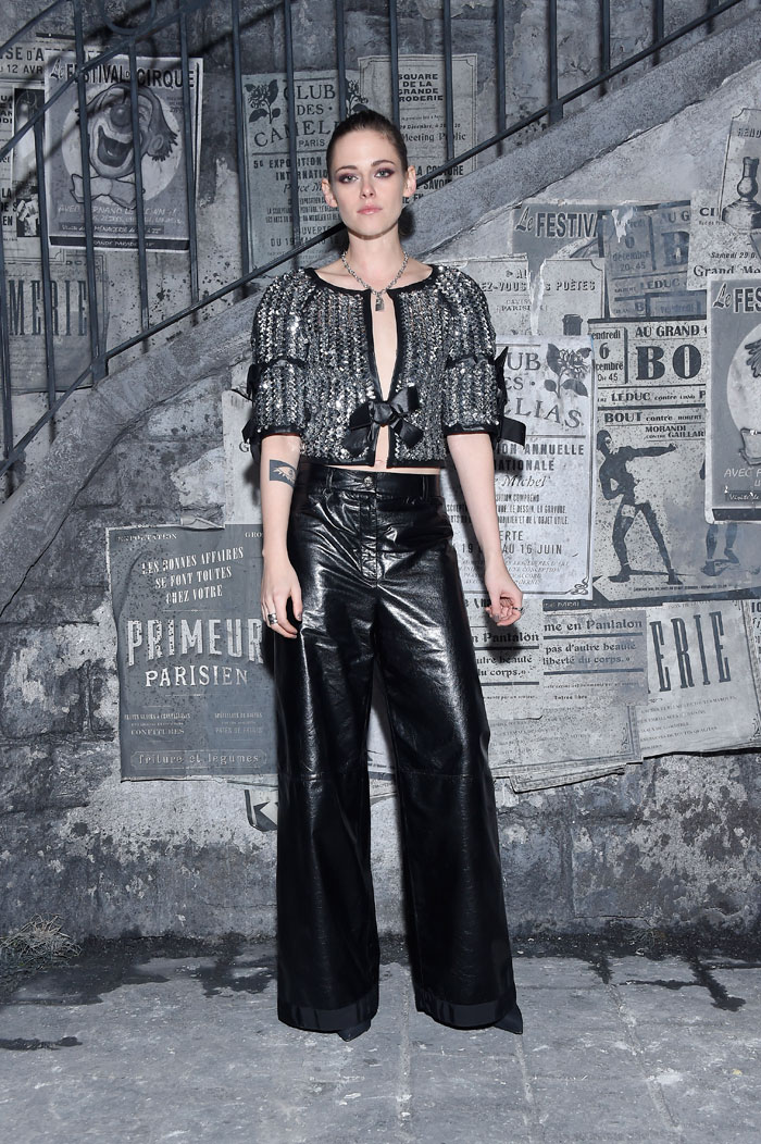 Kristen Stewart at Chanel's Metiers d’Art pre-fall 2016 show in Rome wearing a silver top and black trousers. Photo: courtesy Chanel