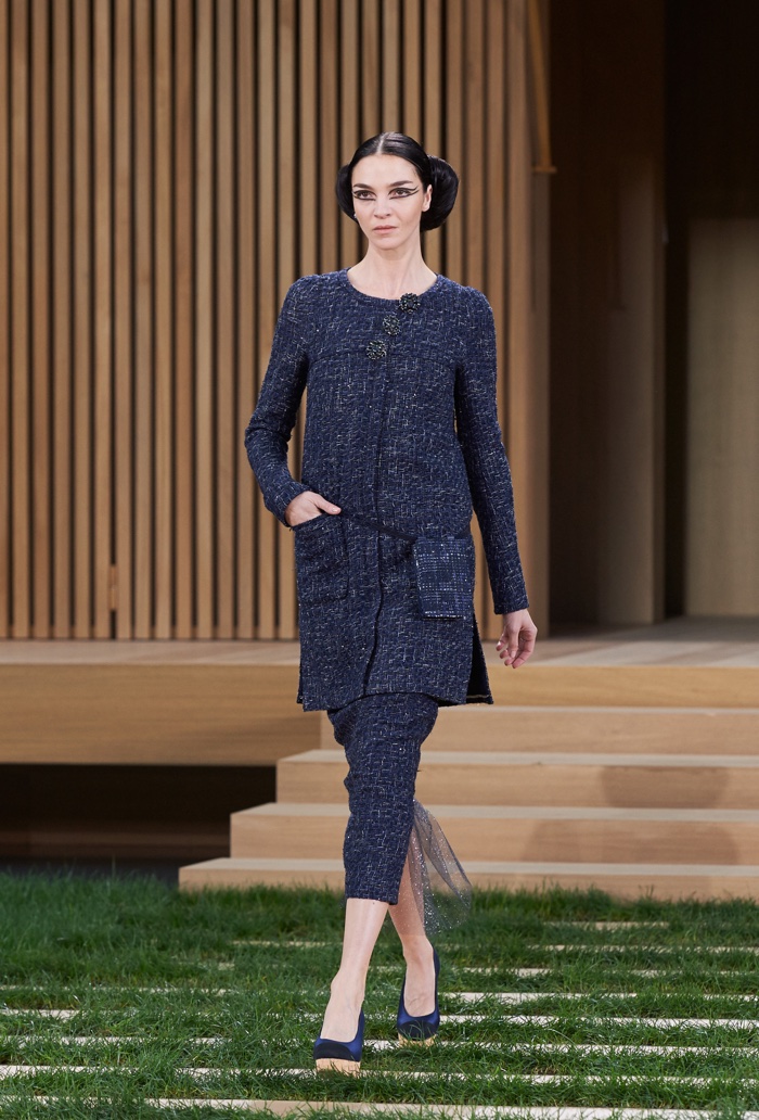 Mariacarla Boscono walks the runway at Chanel's spring 2016 haute couture show wearing a long jacket and matching pencil skirt