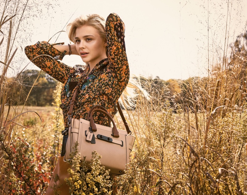 Chloe Grace Moretz poses with the Swagger bag in Coach's spring 2016 campaign