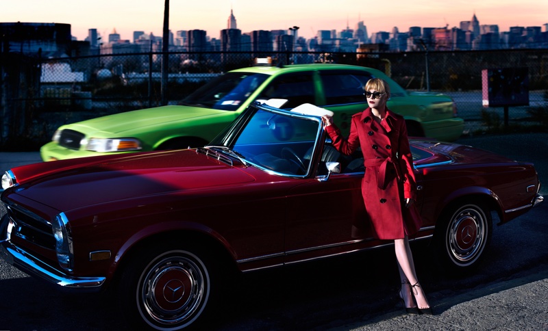 The actress is the very image of elegance in a red trench coat and sunglasses