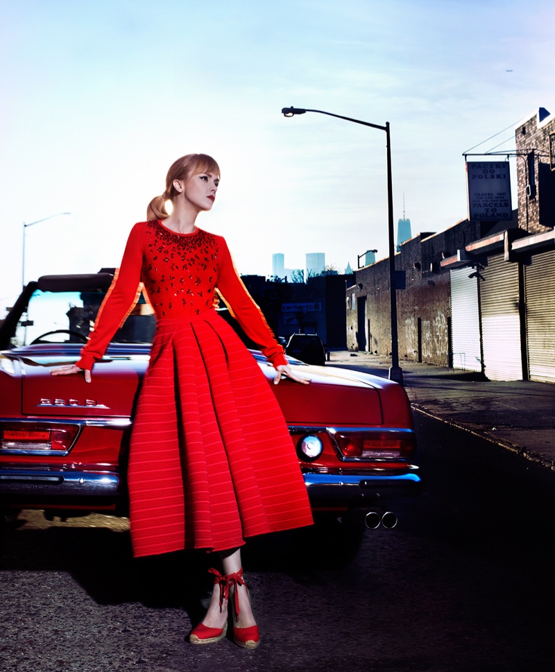 Posing next to a vintage Mercedes-Benz, Christina Ricci models a red long-sleeve fit and flare dress