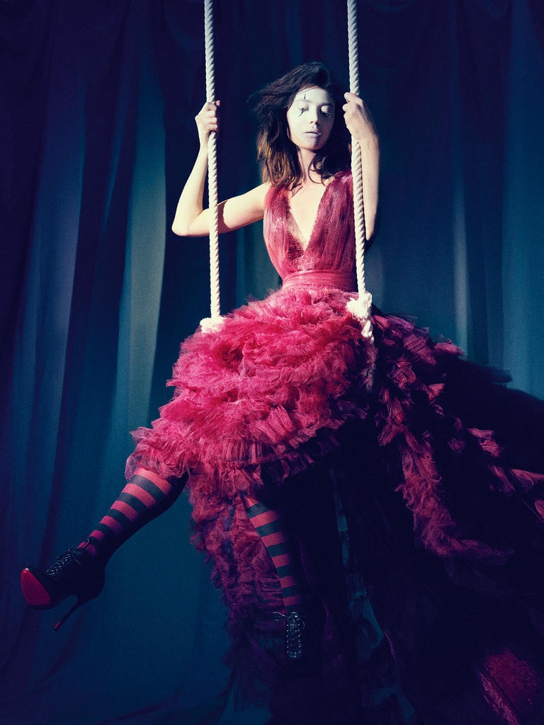 SWING, SWING: Model poses in Marchesa dress and Christian Louboutin boots