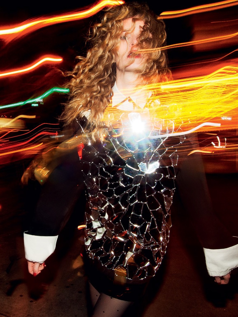 NIGHT OF NIGHTS: Surrounded by city lights, the model shines in a metallic look