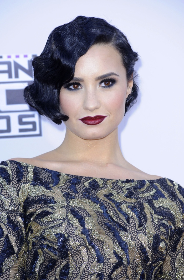 Singer Demi Lovato channels 1920s hair with a short finger wave hairstyle. 