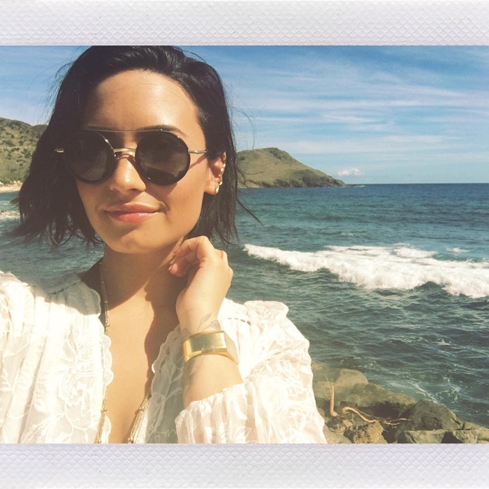 Demi Lovato takes a selfie on the beach with aviator style sunglasses. Photo: Instagram