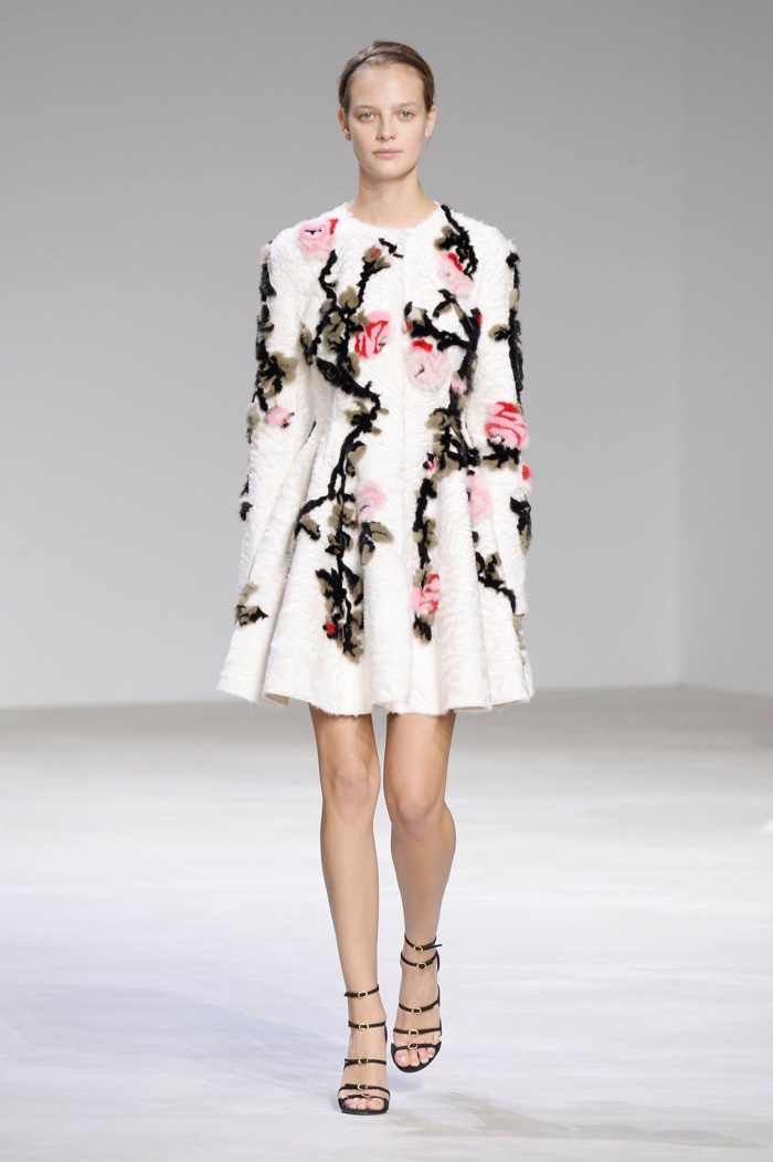 A model walks Giambattista Valli's spring 2016 haute couture show in a long-sleeve floral appliqué dress