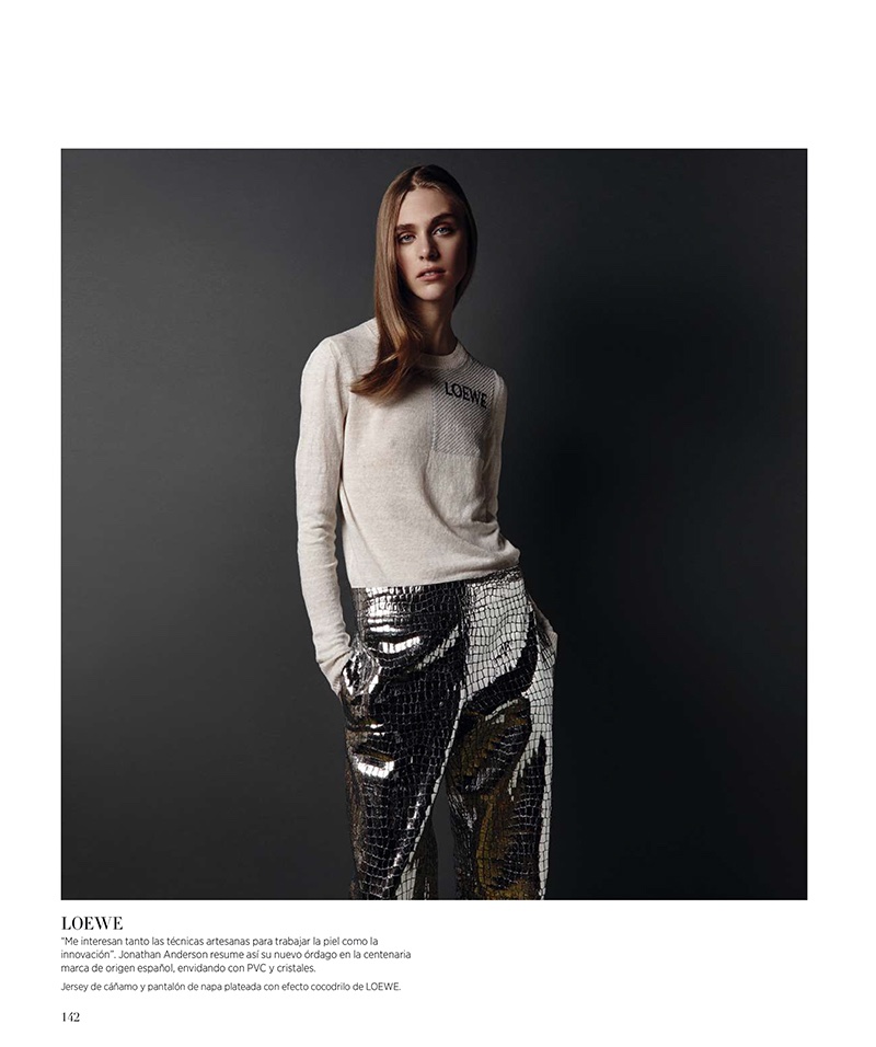 Hedvig wears Loewe sweater and metallic trousers