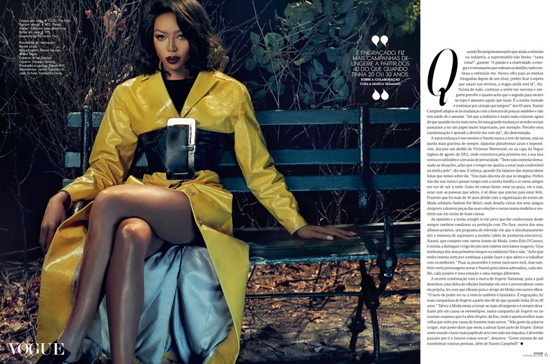 Naomi Campbell poses on a bench while wearing yellow The Row coat
