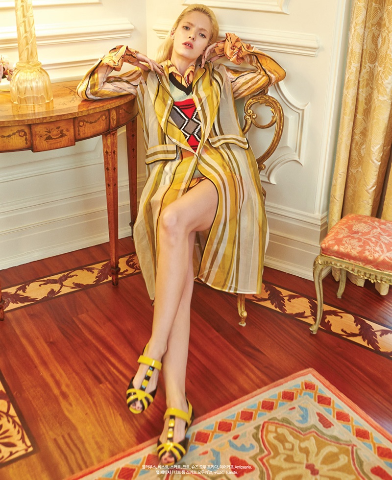 Anastasia models striped jacket and skirt from Prada's spring collection