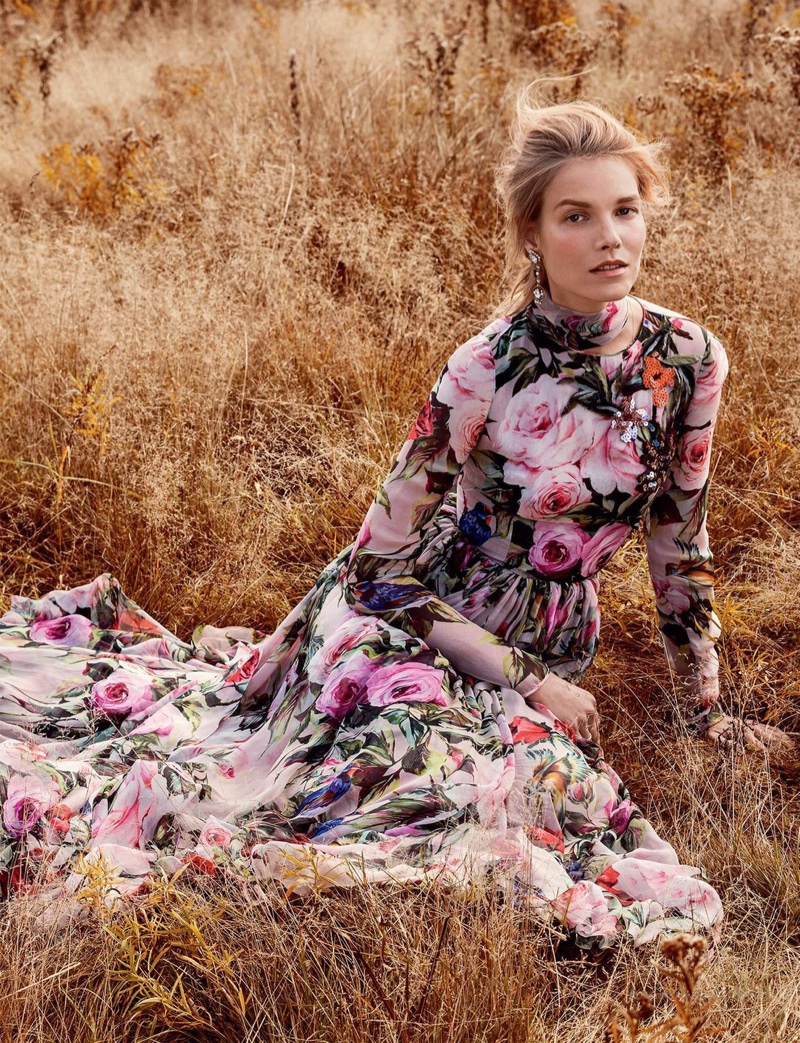 The model wears a floral print maxi dress with long sleeves