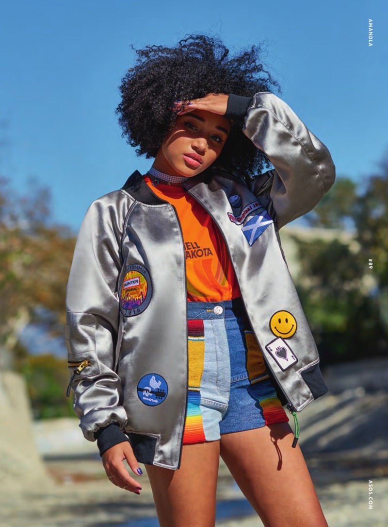 Amandla sports a bomber jacket and vintage denim shorts for the fashion feature