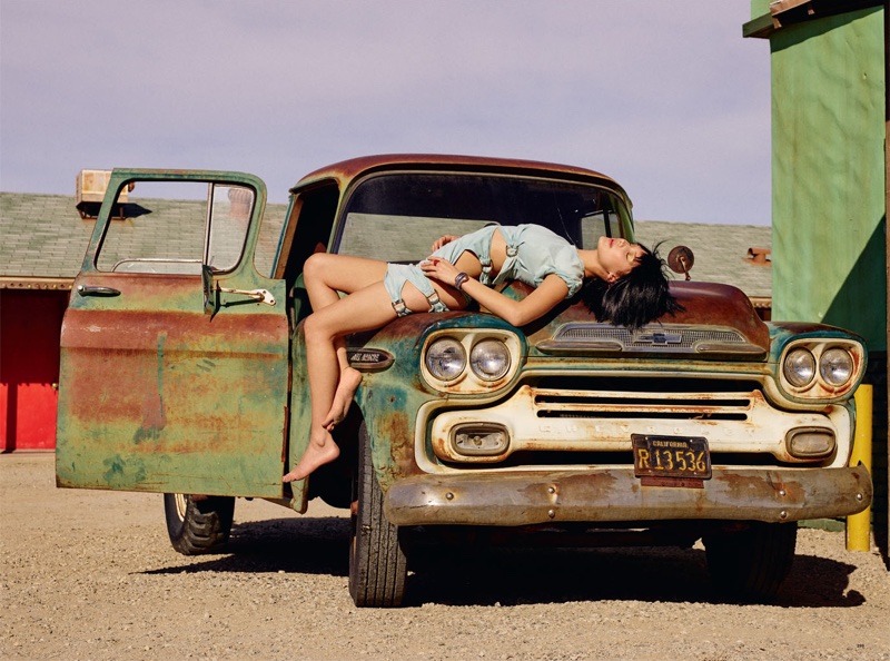 Photographed by Sam Taylor-Johnson, Bella Hadid poses with vintage cars for the fashion editorial