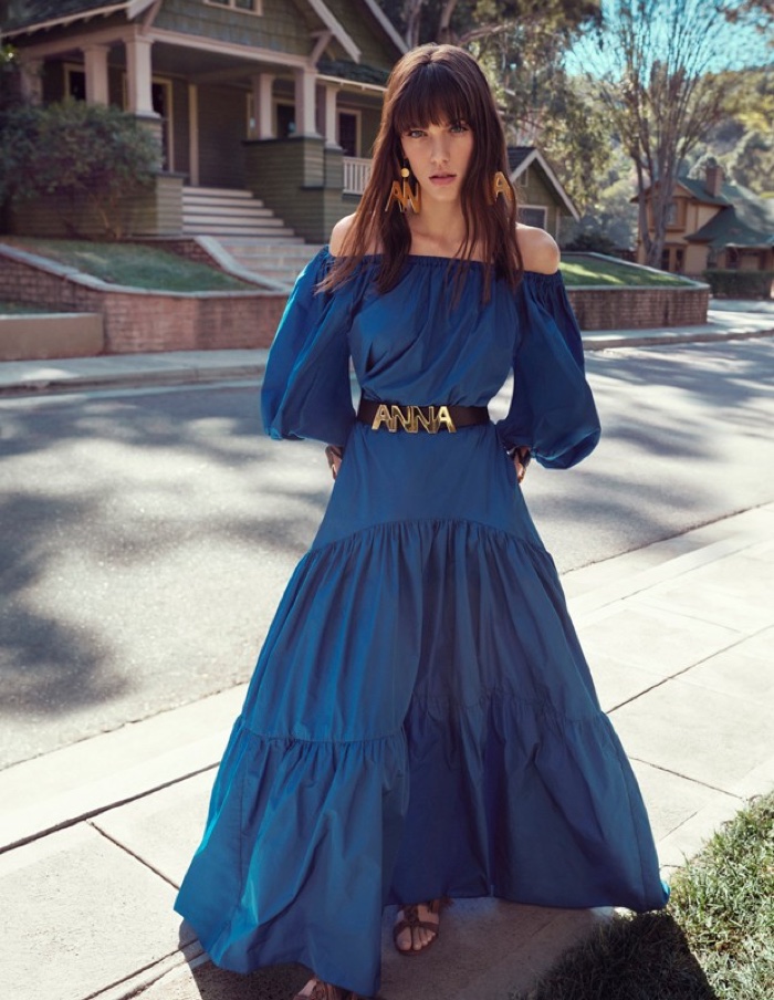 The model wears an off-the-shoulder blue maxi dress from Blugirl's spring 2016 collection