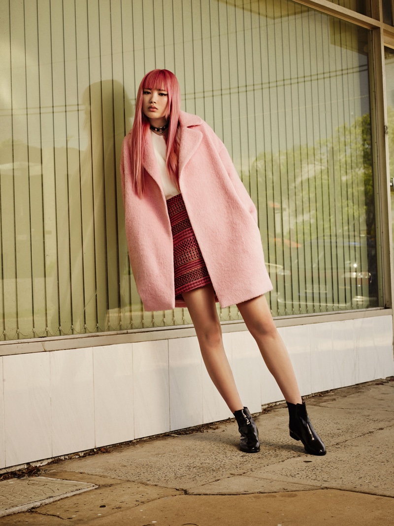 Fernanda wears a pink coat to match her pastel hair