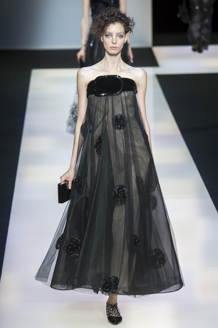A model wears a black strapless gown from Giorgio Armani's fall-winter 2016 collection