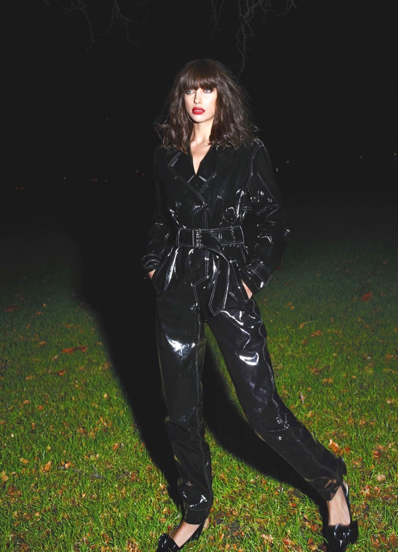 Irina Shayk models a glossy black jumpsuit for the fashion spread