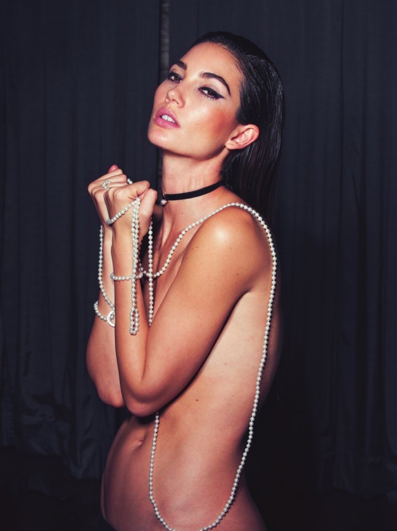 Lily Aldridge poses topless with cross necklace for the feature.