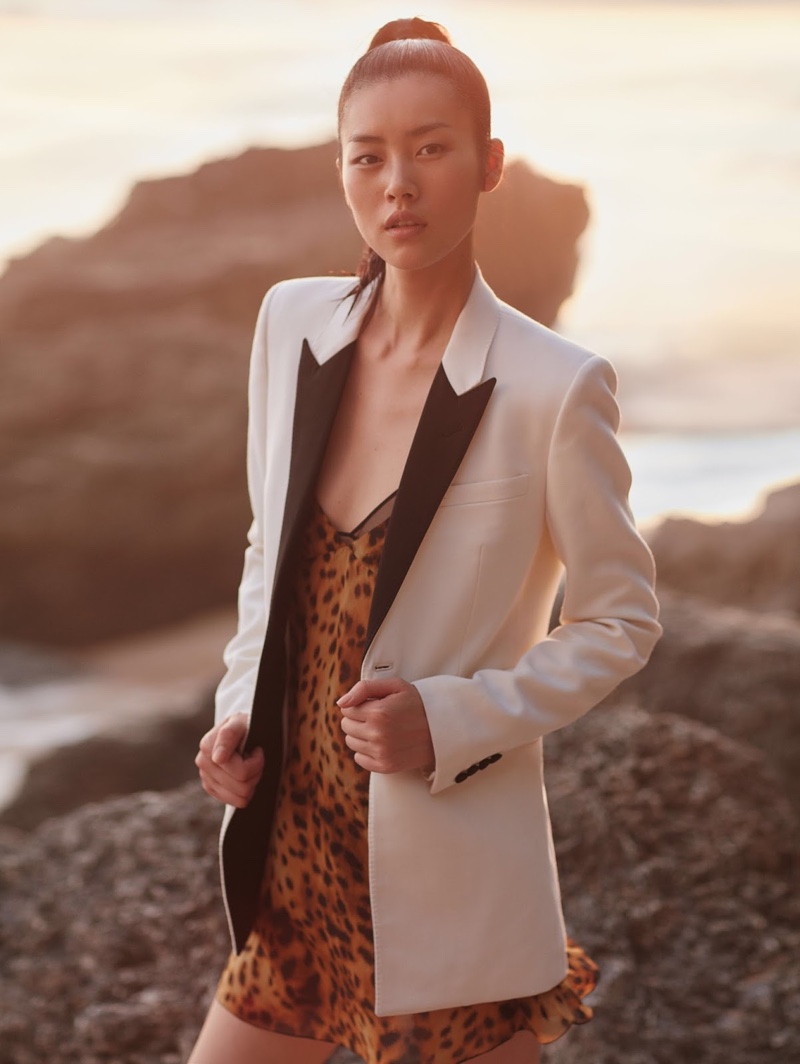 The top model wears a Saint Laurent white blazer and leopard print dress