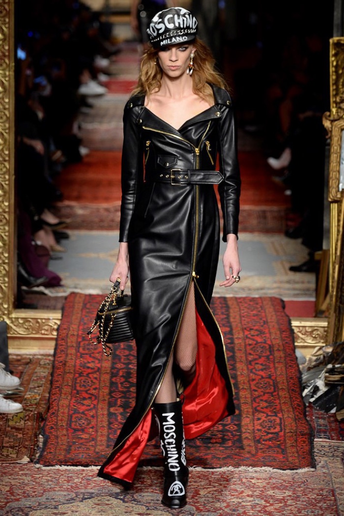 Lexi Boling walks the runway at Moschino's fall-winter 2016 show wearing a leather dress