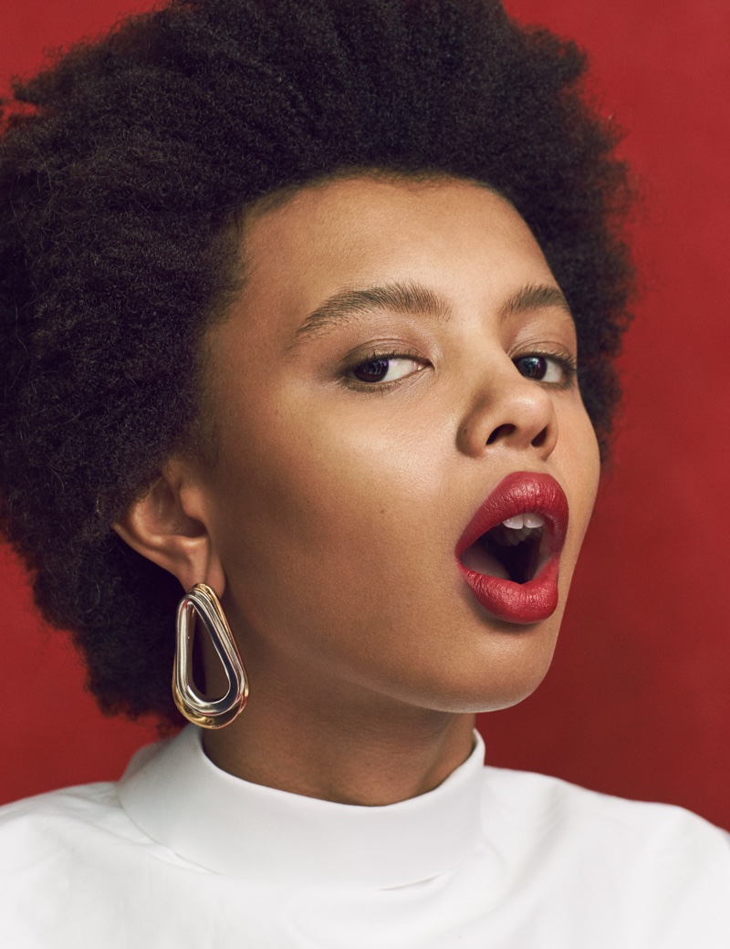 Poppy Okotcha poses with an afro hairstyle in the editorial