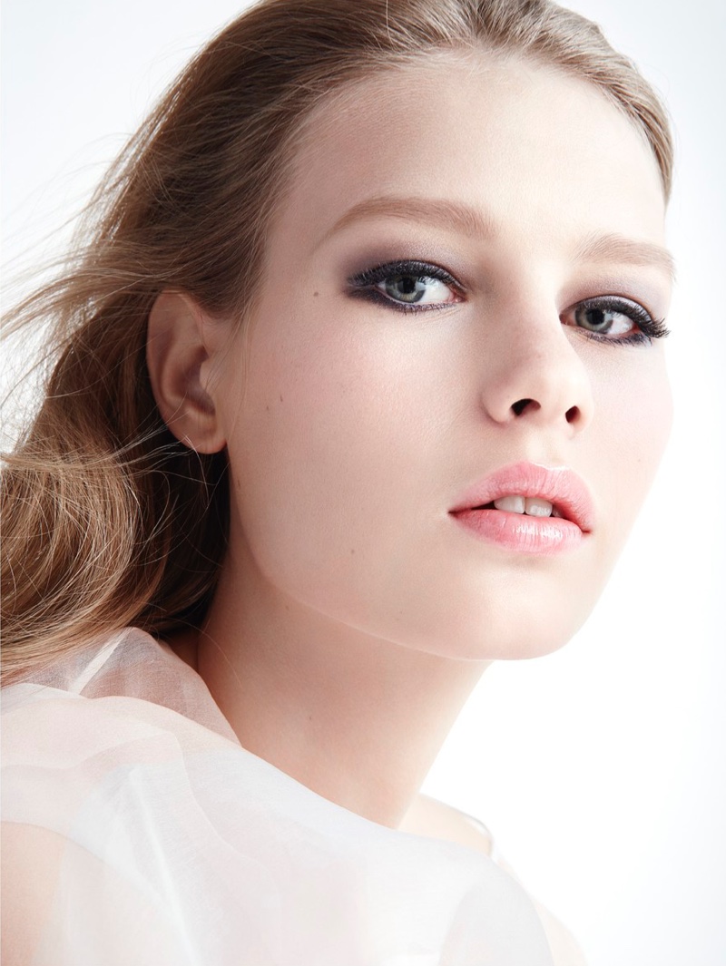 The model poses in makeup looks using Dior Beauty