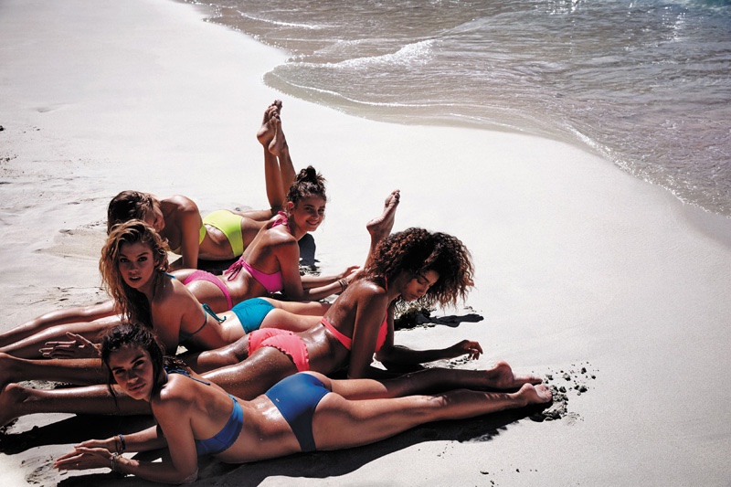 Models lay out on the beach in Victoria's Secret's Swim 2016 catalog